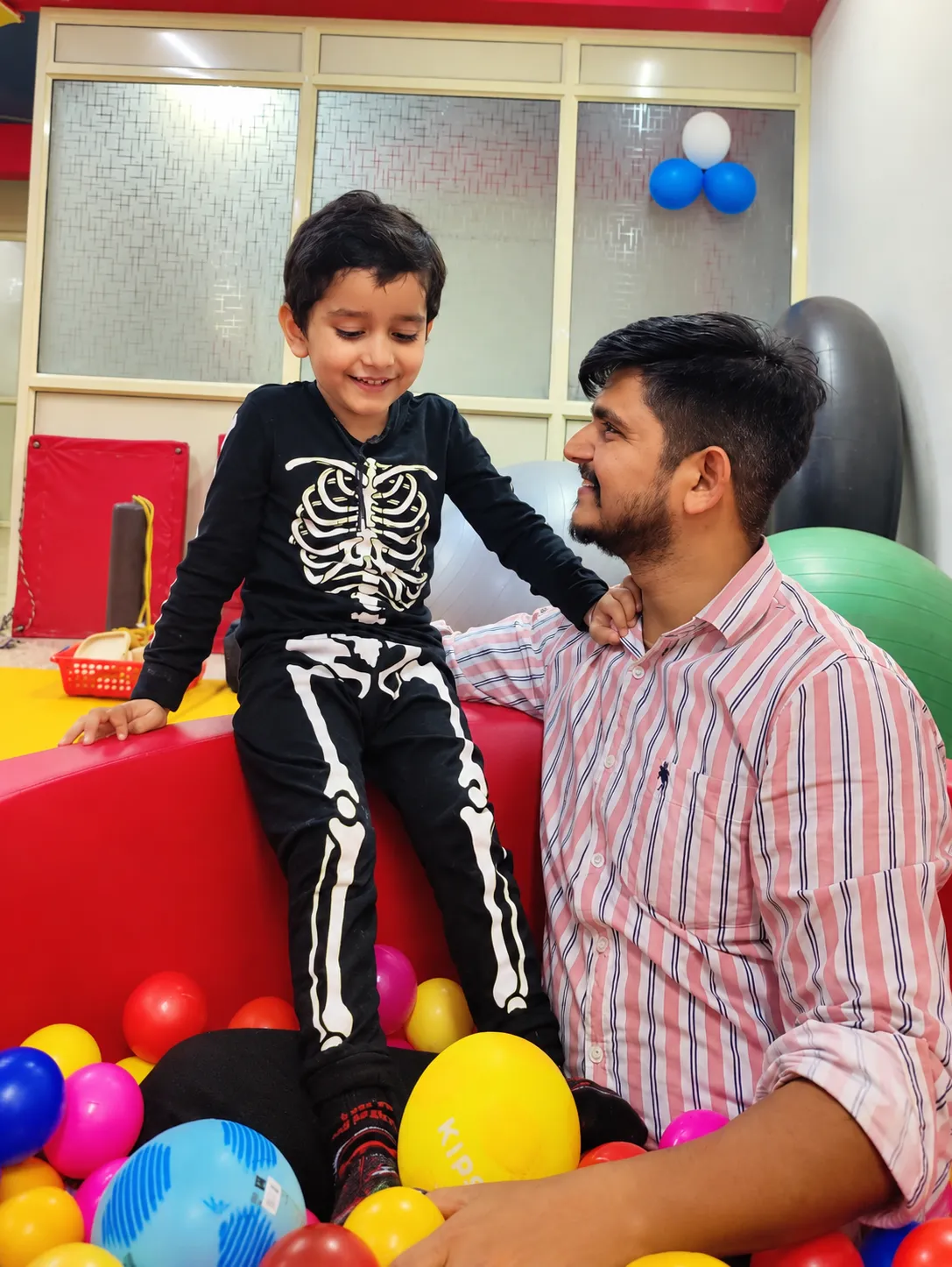 A therapist and child playing together at OT Cloud Therapy Center.
