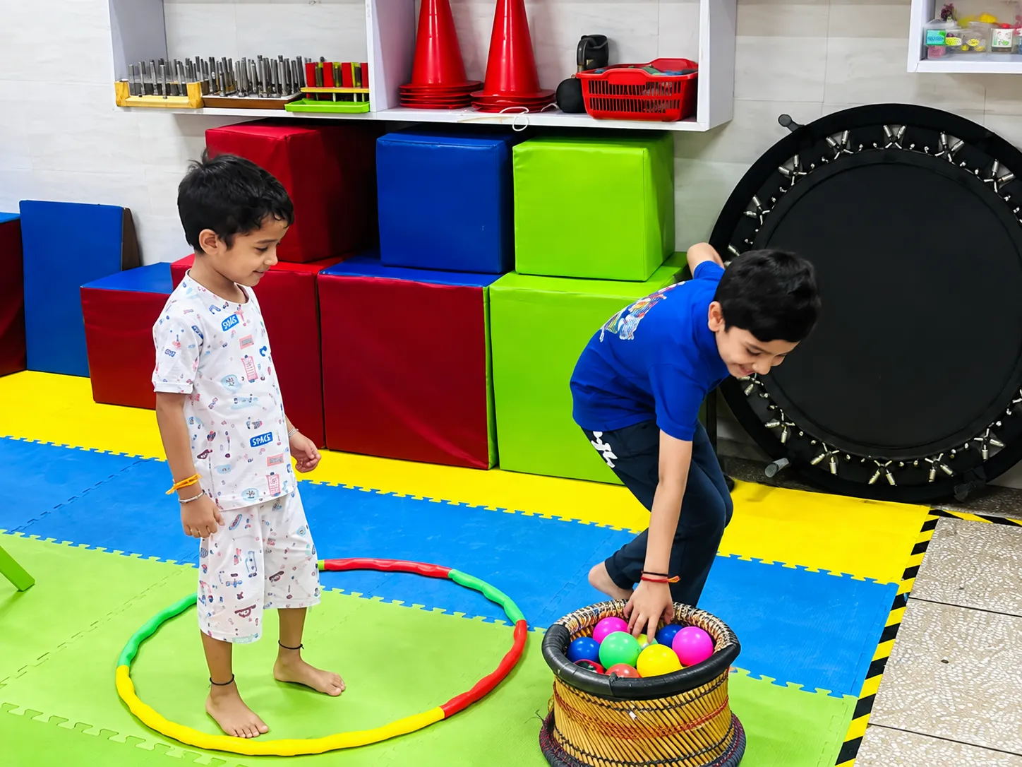 A therapist working through a play-based activity with a child at OT Cloud.