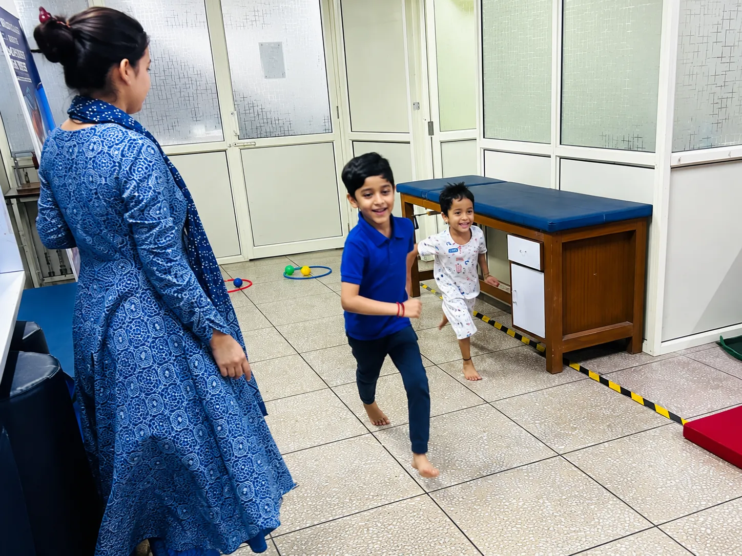 Children moving and running with an OT Cloud physiotherapist.