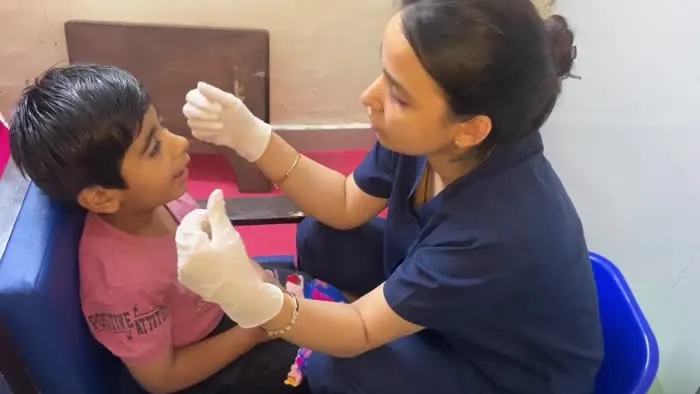 An OT Cloud therapist working with a child during a session.